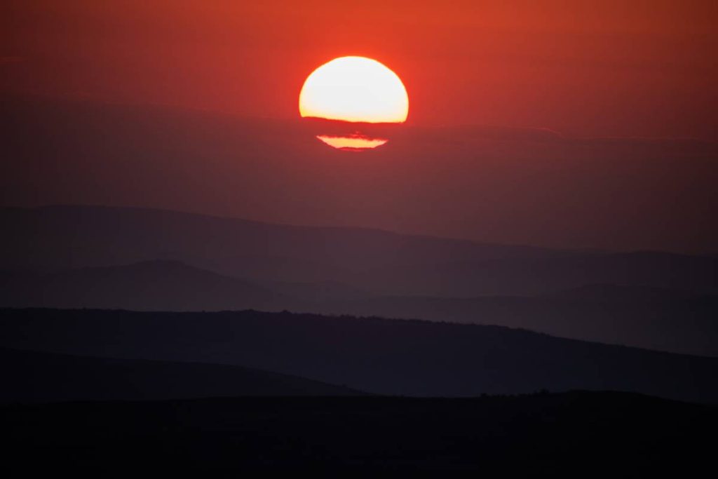 shining orange sun heat wave background