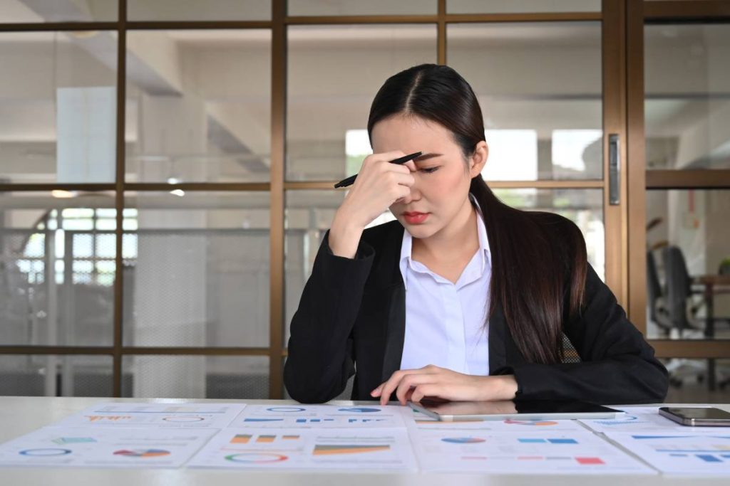 Stressed businesswoman thinking find solution problem of work. Emotional pressure, stress at work concept.