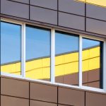 Abstract modern building exterior with colorful window reflection, contemporary architecture