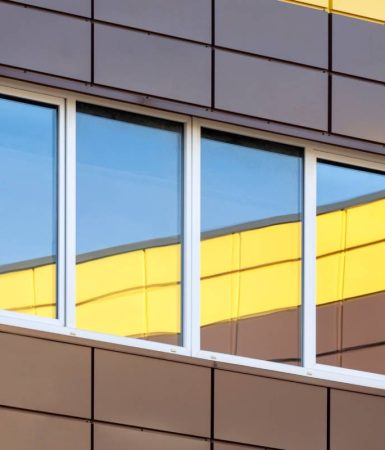 Abstract modern building exterior with colorful window reflection, contemporary architecture