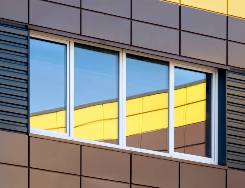 Abstract modern building exterior with colorful window reflection, contemporary architecture