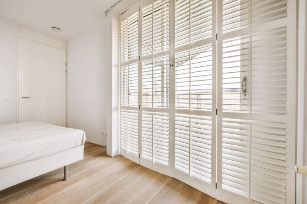 White wooden lattice in windows of a bedroom