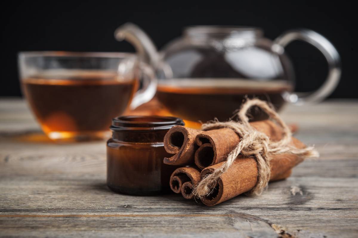 aromatic hot cinnamon tea on wooden table