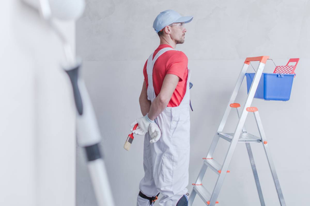 Room Painter and His Job. Apartment Remodeling Concept.